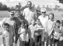 Pictured on the left are Start Off Smart (SOS) and Weed and Seed employees and volunteers with Councilman Elvis R. Maldonado at the Phichol Williams Center Backpack Giveaway. Pictured on the right are Councilman Maldonado and Vice-Mayor Judy Waldman with volunteers and the students who received backpacks for the new school year at the Redland Housing Center.