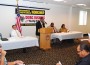 Dr. Ezekiel Orji Finance Director from the City of Opa-locka speaking at the Annual BUSINESS ASSISTANCE WORKSHOP left to right seated Joe Martinez Beacon Council, Mayor Joseph L. Kelley and Cheryl Cook from The South Florida Regional Planning Council.