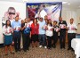 Brisco “The Opa-locka GOON” and Vice Mayor “Lady” Myra L. Taylor surrounded by winners of the Trivia contest, from the Grace Academy School in Opa-locka, during the premier of ”My World, Your World”; Bridging the Gap.”