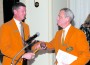 Antonio L. Argiz, Orange Bowl Committee immediate past president, (right) presents the official gavel to Jeffrey T. Roberts, who will serve as the 73rd president and chair of the Orange Bowl Committee.