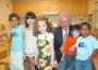 John Kanas is surrounded by children from the United Way Center for Excellence in Early Education — Vladimir, Isabella, Clara, Raul and Ronald.