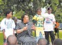 Mayor Taylor gives a pep-talk to the Opa-locka Parks and Recreations Panthers and Hurricane football teams, as Opa-locka Police Chief Cheryl Cason lends support.