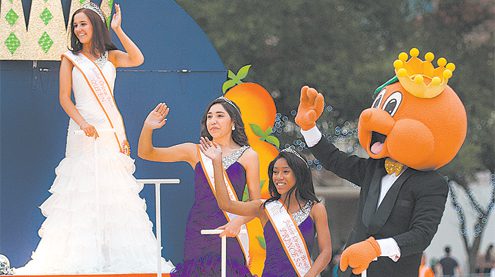 Royal Court greets spectators at Junior Orange Bowl Parade Royal Court greets spectators at Junior Orange Bowl Parade