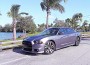 Dodge Charger SRT8 four-door fastback coupe has high-gloss black grille and a new performance-sculpted hood with a black engine air exhauster.