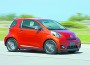 Three-door hatchback Scion iQ has a high beltline running from the large headlights up the A-pillar and across the roof and wrapping around the rear.
