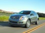 2012 Cadillac SRX has a multi-piece shield grille and iconic vertical headlights; a wide stance, minimal overhangs and the wheels are pushed out to the corners.