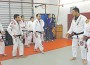 3rd degree black belt Professor Daniel Montanha (second from right) and 7th degree black and red belt Master Carlos Gracie instruct a team of black belts.