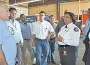 Hope Gibbs and Betty Mendoza from the Gables Fire Department give a brief tour of Station 1 to the international delegation.