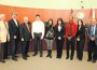 High School Scholarship winners accept awards at recent commission meeting.