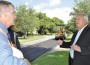 Coral Gables Mayor Jim Cason (right) inspects one of the streets being repaved.