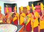 Tibetan Monks from the Drepung Loseling Monastery in Northern India perform a sacred ceremony before the dismantling of the sand mandala