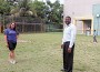 Yvette Valdes and Carl Williams join a kickball game while Recreation and Parks Director Lorenzo Woodley watches in the background