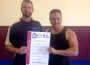 Steve Ledford receives certificate with Dave Clark, trainer.