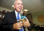 Miami-Dade County Mayor Carlos Gimenez with Pet’s Trust Miami Mascot Pepe Sal, named after Commissioner’s Jose “Pepe” Diaz and Sally Heyman.