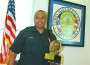 Sergeant John Wyche accepting the Olympic Torch Award 2012.