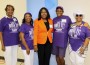 Bola Olayinka of War on Poverty surrounded by members of the Opa-Steppers