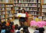 City of Opa-locka Mayor “Lady” Myra L. Taylor reads to students, teachers and the staff from the Opa-locka Branch of Miami Dade County Library, in celebration of National Library Week.
