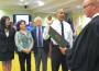 Samuel Ceballos, Jr. is sworn into office as Pinecrest Police Chief by Judge Bill Altfield, while Village Manager Yocelyn Galiano Gomez, Mayor Cindy Lerner and Councilmember Bob Ross look on. (Photo by Hal Feldman)
