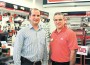 Sansone Group’s Luis Diaz, property manager for Old Cutler Towne Center, (left) is pictured with Valdin Llano, Ace Hardware store owner.
