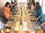 Customers enjoy the 45-foot salad bar during Sweet Tomatoes’ preview fundraiser.