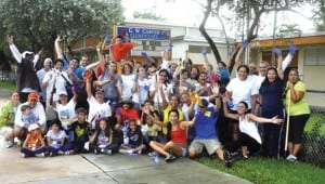  Miami-Brickell Rotarians seen here with students while volunteering to improve grounds at Carver.