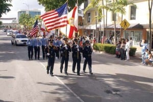 South Miami Police department stands at attention during the Santa’s parade showing off they’re patriotism to the crowd!