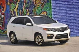Sorento CUV has a rounded nose, an angled window line, signature Kia grille, wraparound headlights and prominent fog lights.