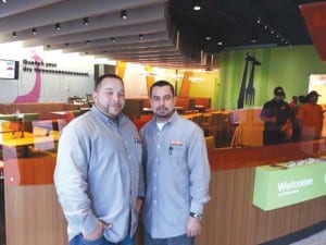 Victor Vazquez (left) and Carlos Cotto manage Giraffas in Pinecrest.