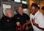 Enjoying a laugh at the grand opening of the Kendall Shula Burger are (l-r) former Dolphins Coach Don Shula,
Shula Burger president Scott Nietschmann, and Dolphins Alumni president Nat Moore.