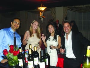 Seen enjoying Coral Gables Woman’s Club Installation and Holiday Party are a few of the 13 new members, including two seen here Kara Corniel (center left) with husband, Ariel, and Lorie Marie Dilan with her husband, John Lopez.