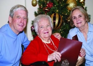 Pictured in front of the Christmas tree at The Palace are Rod, Ruth and Wendy (Moffett) Morris.