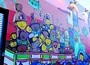 Artists create a wall mural in Wynwood Art District during