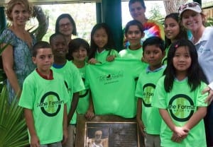 The first eight children to receive scholarships this summer from the Dade County Sports Foundation gather around the Dorothy Forman Memorial at Howard Drive Elementary School. Adults, from left to right: Julie Sierra, Tutti Bambini Health and Wellness Director; Laura Rossano, Dade County Sports Foundation Director; Christina Diaz, Howard Drive Assistant Principal; Jane Forman, Director of Jane Forman Sports. Download a printable version of this photo here. 