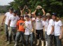 Students taking part in Belen Jesuit’s 2013 Belen Youth Mission Trip pose for a picture while holding building tools.