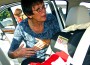 Janice Pruett from Safer Kids and Homes demonstrates
proper installation during a free car seat safety event in Miami.