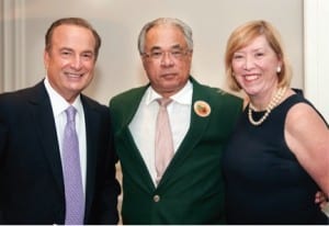 Eliott Rodriguez of CBS 4 (left) is pictured with Junior Orange Bowl president Dr. Robert Bueso (center) and past president Jeannett Slesnick