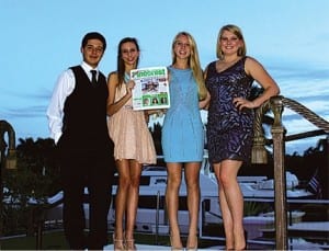 All dressed up and ready to go to the Palmetto Senior High School Homecoming dance are (l-r) Travis Rambo, Sarah Waters, Amber Mohlman and Julia Finazzo. Of course they paused a moment to get their picture snapped with a copy of their favorite hometown newspaper. Thanks for thinking of us, guys!