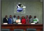 City Award Scholarship presented to Students at City Commission Meeting. (Pictured from Left to Right): Commissioner Thomas Dorsett, Vice Mayor Felicia M. Brunson, Mayor Eric H. Jones, Student Recipient Ms. Gisla Bush, Commissioner Rita Mack, Chair of the Education Advisory Committee (EAC) Ms. Lisa Mays, (EAC) Vice Chair Ms. Dominique Dumervil, and (EAC) Committee member, Mr. Ronald Bell.
