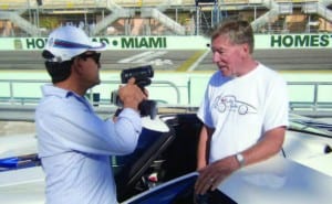 Rides ’n Smiles founder Bill Adam is interviewed by automotive journalist Javier Mota at the Homestead- Miami Speedway.