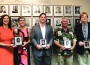 Inductees stand in front of the Athletic Hall of Fame with special commemorative plaques. Pictured (l-r) are JoAnn Hanko and Gloria MaCovoy (sisters of Joe Hanko, Class of 1980, accepting the award on his behalf), Kevin Sanz, ’01; Dave Hewett, ’81, and Burford Smith, ’81.