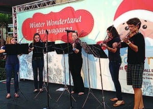 Palmer Trinity School music students perform for more than 1,500 parents and children at Kendall Regional Medical Center’s annual Winter Wonderland Extravaganza and Tree Lighting Ceremony on Dec. 6. Pictured (lr) are Emily Kalbac, Wynne Owre, April Queen, Carolina Maller and Michael Eschmann. For more information about the school, visit .
