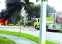Fire engulls cars next to After School House