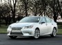 2014 ES 300h has a familiar spindle grille and running lights up front, with hidden exhaust and an integrated spoiler defining the rear.