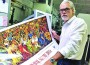 Humberto Benitez is pictured with his poster.