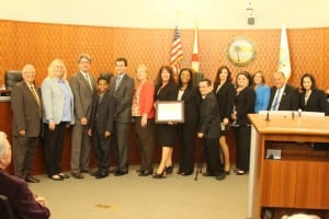 GFOA Award - Left to right: Mayor Norman S. Edelcup, Commissioners Jennifer Levin and George “Bud” Scholl, NSE SIB K-8 Student Council President Timothy Bryd, Purchasing Agent Andrew Rozwadowski, Executive Assistant to City Manager Cheryl Williams, Finance Director Audra Curts-Whann, Assistant Finance Director Tiffany Neely-Jean, Senior Accountant Joe Glendale, Accounting Technician Elena Pavlova, Accounting Technician Janet Diaz-Rego, Cultural & Community Services Director Susan Simpson, Vice Mayor Isaac Aelion, Commissioner Jeanette Gatto.