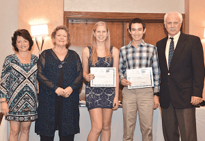 Palmetto High School graduating seniors Jessica Roth and Carlos Rafael Suhr hold their Alumni Association scholarshipcertificates presented by association members (l-r) Village Mayor Cindy Lerner, Betsey Bystock and Walt Zimmerman.