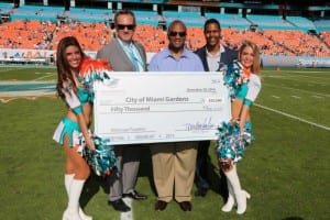 (L-R) Miami Dolphins President & CEO Tom Garfinkel, Miami Gardens Mayor Oliver G. Gilbert III, Miami Dolphins Senior Director of Community Affairs Twan Russell