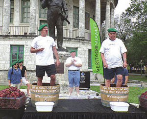 Coral Gables Farmer’s Market on Saturday, Mar. 7, featured the Veritage Grape Stomping Competition. Pictured is the event champion, Chamber president Mark Trowbridge, in background, as he cheers on two competitors Jeffrey Welch, president and CEO of Coral Gables Hospital, and Coral Gables Mayor Jim Cason.