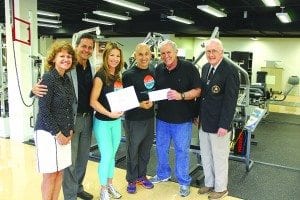 Pictured are (l-r) Marsha Talianoff, Dr. Etiony Aldorondo, Unni Greene, William Del Sol presents a donation to the University of Miami’s Dr. Joseph Signorile, and Florida NPC chairman Peter Potter met at the UM School of Kinesiology to celebrate the success of the first annual Mr. & Ms. Fit South Miami.