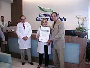 (l-r) are Dr. Marco Amendola, Director of Medical Imaging at ICI, Dr. Beatriz Amendola and Miami Dade Commissioner Xavier Suarez with the proclamation.